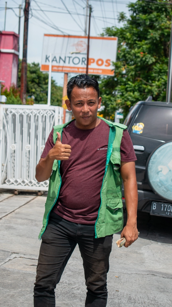 Balinese parking attendant